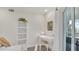 Bright office nook with white furniture, natural light, and serene decor for a productive workspace at 4307 Sea Mist Dr # 135, New Smyrna Beach, FL 32169
