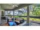 Enjoy a relaxing screened patio with comfortable seating and lush, green views at 4307 Sea Mist Dr # 135, New Smyrna Beach, FL 32169