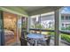 Relax in this screened patio with comfortable seating and views of nature at 4307 Sea Mist Dr # 135, New Smyrna Beach, FL 32169