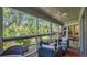 Relaxing screened porch surrounded by lush greenery at 4307 Sea Mist Dr # 135, New Smyrna Beach, FL 32169