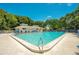 Dive into relaxation with the large, sparkling pool and ample seating perfect for sunny days at 4307 Sea Mist Dr # 135, New Smyrna Beach, FL 32169