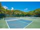 Enjoy a match on these well-maintained tennis courts surrounded by lush greenery and beautiful blue skies at 4307 Sea Mist Dr # 135, New Smyrna Beach, FL 32169