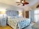 Serene bedroom with coastal decor, a unique headboard, and wood-look flooring at 438 Bouchelle Dr # 104, New Smyrna Beach, FL 32169