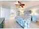 Bright bedroom with light hardwood flooring, coastal bedding, and ample natural light at 438 Bouchelle Dr # 104, New Smyrna Beach, FL 32169