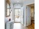 Bright entryway featuring a seashell mirror and ample natural light at 438 Bouchelle Dr # 104, New Smyrna Beach, FL 32169
