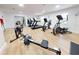 Light and bright fitness center with rowing machine, treadmills, and other exercise equipment at 438 Bouchelle Dr # 104, New Smyrna Beach, FL 32169