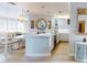 Modern kitchen featuring white cabinetry, stone countertops, and stainless steel appliances at 438 Bouchelle Dr # 104, New Smyrna Beach, FL 32169