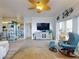 Bright living room with waterfront views, stylish furnishings, and coastal decor at 438 Bouchelle Dr # 104, New Smyrna Beach, FL 32169