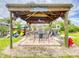 Outdoor entertainment pavilion with ceiling fan, dartboard, and fire hydrant offers a relaxing space at 438 Bouchelle Dr # 104, New Smyrna Beach, FL 32169