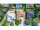 Aerial view of homes, including swimming pool, with surrounding landscaping at 4431 Doris Dr, New Smyrna Beach, FL 32169