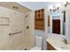 Bathroom with a tiled shower, grab bar and built in shelving at 4431 Doris Dr, New Smyrna Beach, FL 32169