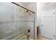 Updated bathroom with glass shower door and tile at 4431 Doris Dr, New Smyrna Beach, FL 32169