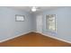 Bedroom featuring fan, wood-look flooring, and natural light at 4431 Doris Dr, New Smyrna Beach, FL 32169