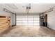 Spacious garage includes an automatic door and built in shelving at 4431 Doris Dr, New Smyrna Beach, FL 32169