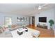Stylishly furnished living room with a large sofa, modern decor, and laminate flooring at 4431 Doris Dr, New Smyrna Beach, FL 32169