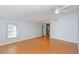 Spacious living room boasts laminate flooring, ample natural light, and a ceiling fan at 4431 Doris Dr, New Smyrna Beach, FL 32169