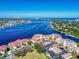Beautiful aerial view of waterfront condo community near the bridge, with ocean views in the background at 468 Bouchelle Dr # 128, New Smyrna Beach, FL 32169