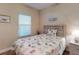 Charming bedroom with natural light, neutral walls, and a decorative headboard at 468 Bouchelle Dr # 128, New Smyrna Beach, FL 32169