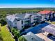 Beautiful condo complex with lush landscaping, covered parking, and plenty of visitor parking at 468 Bouchelle Dr # 128, New Smyrna Beach, FL 32169