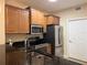 Modern kitchen with stainless steel appliances, sleek countertops, and ample cabinet space for storage at 468 Bouchelle Dr # 128, New Smyrna Beach, FL 32169