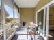 Covered lanai featuring comfortable seating with peaceful outdoor views at 468 Bouchelle Dr # 128, New Smyrna Beach, FL 32169