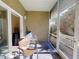 Screened lanai with outdoor seating providing tranquil outdoor views at 468 Bouchelle Dr # 128, New Smyrna Beach, FL 32169