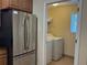 Conveniently located laundry area with a modern washer and dryer, adjacent to the kitchen at 468 Bouchelle Dr # 128, New Smyrna Beach, FL 32169