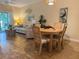 Well-lit living room featuring coastal decor, wooden floors, and comfortable seating at 468 Bouchelle Dr # 128, New Smyrna Beach, FL 32169