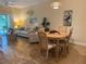 Inviting living room with stylish furniture, coastal decor, and wood-look floors, offering a relaxing atmosphere at 468 Bouchelle Dr # 128, New Smyrna Beach, FL 32169