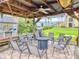 Relax and enjoy this outdoor patio featuring a fire pit and seating for entertaining at 468 Bouchelle Dr # 128, New Smyrna Beach, FL 32169