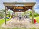 Relax and enjoy this outdoor patio featuring a fire pit and seating for entertaining at 468 Bouchelle Dr # 128, New Smyrna Beach, FL 32169