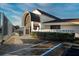 Exterior view of the activity center featuring unique architecture, professional landscaping, and accessible parking at 481 Sweet Bay Ave, New Smyrna Beach, FL 32168