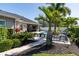 Lush landscaped backyard featuring a pool, spa, lounge chairs, and outdoor dining area at 481 Sweet Bay Ave, New Smyrna Beach, FL 32168
