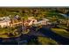 Aerial view of the community clubhouse, golf course, and parking at 481 Sweet Bay Ave, New Smyrna Beach, FL 32168