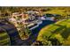 Community clubhouse with golf course, parking, and landscaping at 481 Sweet Bay Ave, New Smyrna Beach, FL 32168