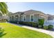 Charming home featuring an attached garage and immaculate landscaping at 481 Sweet Bay Ave, New Smyrna Beach, FL 32168