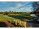 Beautiful golf course view showcasing the manicured greens, surrounding trees, and lush landscaping at 481 Sweet Bay Ave, New Smyrna Beach, FL 32168