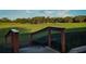 Scenic view of the lush green golf course with well-manicured lawns and mature trees under a clear blue sky at 481 Sweet Bay Ave, New Smyrna Beach, FL 32168