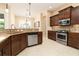 Updated kitchen with granite countertops, stainless steel appliances, and ample cabinet space at 481 Sweet Bay Ave, New Smyrna Beach, FL 32168
