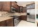 Well-equipped kitchen featuring stainless steel appliances, granite countertops, and tiled backsplash at 481 Sweet Bay Ave, New Smyrna Beach, FL 32168