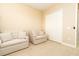 Comfortable living room offering neutral tones, plush seating and a spacious walk-in closet at 481 Sweet Bay Ave, New Smyrna Beach, FL 32168