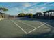 Well-maintained tennis court with clear lines and professional netting, ready for competitive play and recreational enjoyment at 481 Sweet Bay Ave, New Smyrna Beach, FL 32168