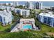 Aerial view of complex showcasing the pool, buildings, and beach at 5300 S Atlantic Ave # 14-202, New Smyrna Beach, FL 32169