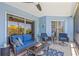 Relaxing blue-themed balcony with comfortable seating and views of the nearby building at 5300 S Atlantic Ave # 14-202, New Smyrna Beach, FL 32169