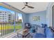 Comfortable blue-themed balcony with seating area, offering a view of the surrounding landscape at 5300 S Atlantic Ave # 14-202, New Smyrna Beach, FL 32169