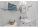 Modern bathroom with a bright vanity, mosaic tile accents, and a recessed niche, creating a clean and stylish space at 5300 S Atlantic Ave # 14-202, New Smyrna Beach, FL 32169