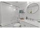 Clean bathroom with a shower-tub combination, a modern vanity with a marble countertop, and ample natural light at 5300 S Atlantic Ave # 14-202, New Smyrna Beach, FL 32169