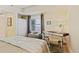 Cozy bedroom featuring a comfortable bed, a functional desk area, and a closet, all designed for rest and productivity at 5300 S Atlantic Ave # 14-202, New Smyrna Beach, FL 32169