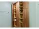Open closet with wooden cabinets and shelves, providing ample storage space at 5300 S Atlantic Ave # 14-202, New Smyrna Beach, FL 32169