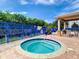 Community hot tub with privacy fencing and covered lounge area at 5300 S Atlantic Ave # 14-202, New Smyrna Beach, FL 32169